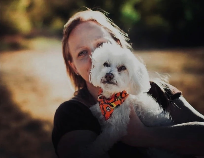Dori holding Mono, her first dog.